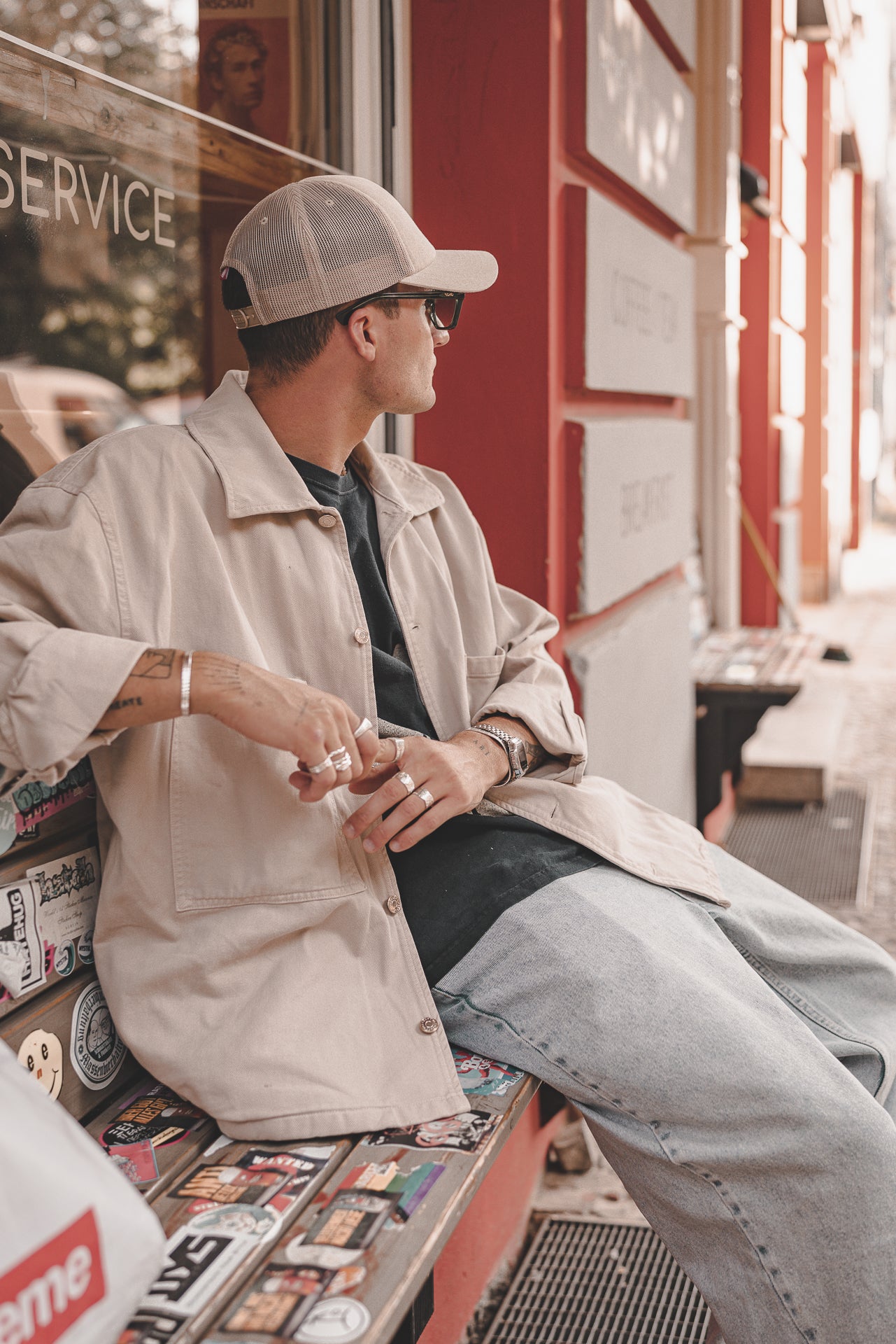 Man sitting on bench with trucker cap