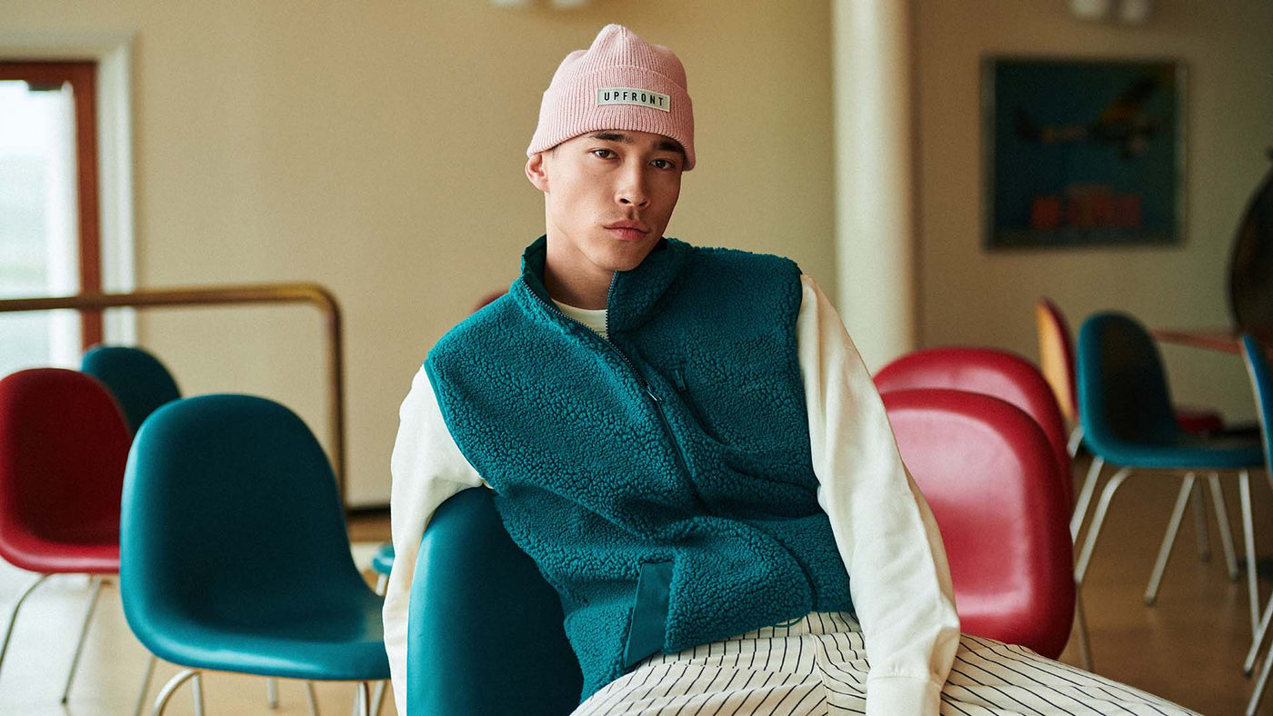Man setting with a beanie on his head